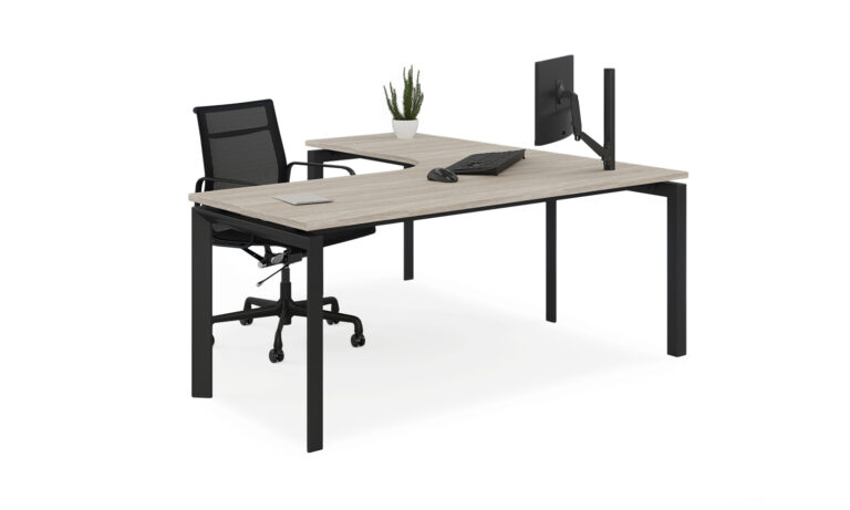 3/4 side front view of black Energy corner desk module with task seat and computer