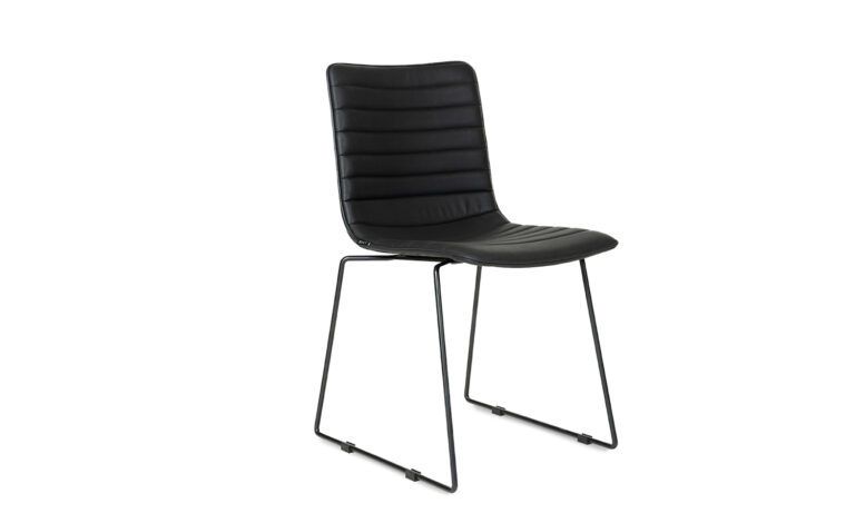 3/4 side front view of a black faux leather Paige Sled meeting chair