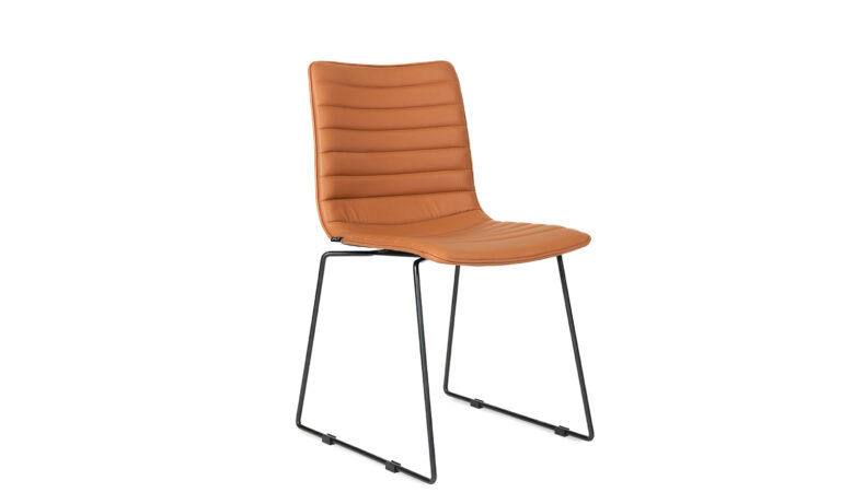 3/4 side front view of an orange faux leather Paige Sled meeting chair